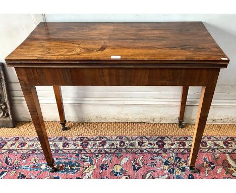 A good quality George III cross-banded mahogany card table, the fold over top with baize lined interior raised on a double ga