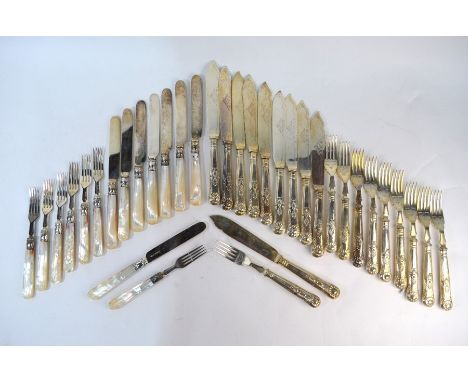 A part set of eight Victorian silver dessert knives and seven forks with carved mother-of-pearl handles, Birmingham 1876, to/