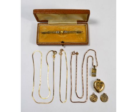 Two yellow metal snake link chains, one with yellow metal pendant stamped 9ct, two 9ct St Christopher pendants, and a yellow 