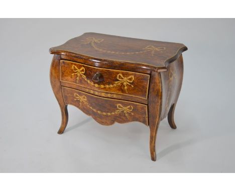 A Continental stained wood and penwork two-drawer miniature commode of bombe form, 29 cm wide