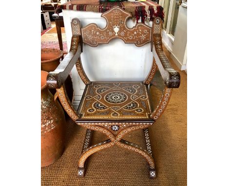 NOTE AMENDED DESCRIPTION - An antique Italian Savonarola chair, the elaborately ivory/bone and mother of pearl inlaid hardwoo