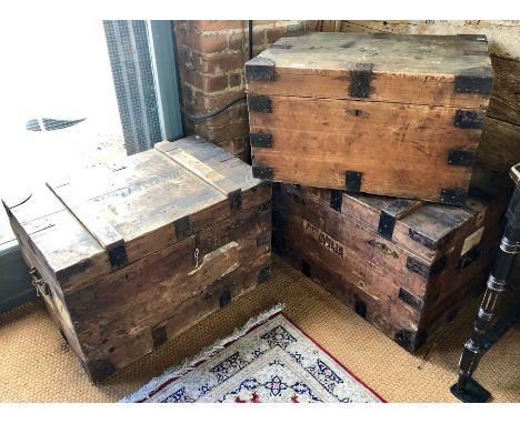 A pair of 1930's steel bound pine travel trunks, with twin locks (no keys, unlocked) and zinc lined interiors and the remnant