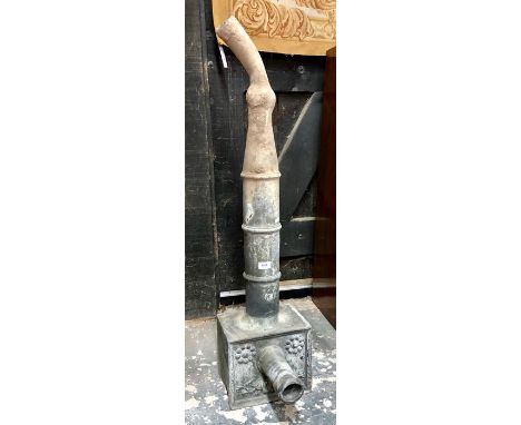 An 18th century lead rainwater hopper, the relief moulded rectangular body with tube outlet over a tubular downpipe, 110 cm h