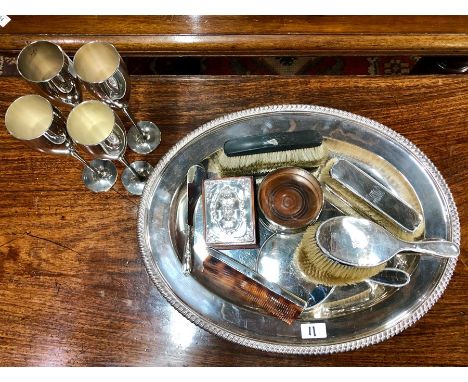 A silver backed six-piece brush set, to/w a trinket box with silver-mounted lid, a set of four P&amp;O electroplated champagn