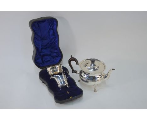 An Edwardian silver bachelor teapot with cut rim and ebonised finial and handle, on hoof feet, Charles Boyton III, London 190