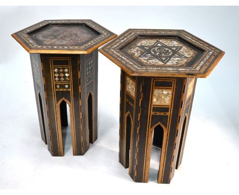 Two old Moorish mother of pearl inlaid octagonal tables, one with (later) leather top, 35 cm dia. and 32 cm dia. x 48 cm h (2