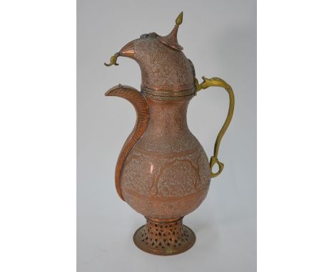 A Persian Qajar pear-shaped copper large coffee pot, the hinged buta cover with hinged top finial, serpentine spout with hing