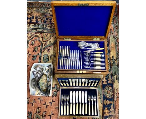 An Elkington &amp; Co. oak canteen of mixed electroplated flatware and ivory-handled cutlery (early 20th century), to/w an oa