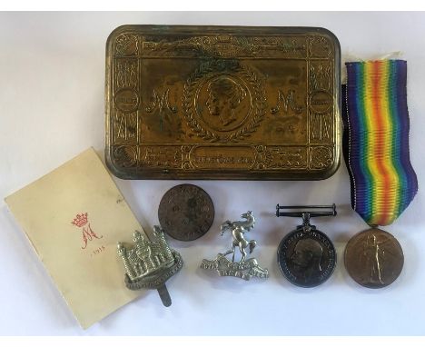 A WWI pair to 330519 R.J. Simpson Camb. R. comprising 1914-18 War Medal; Victory Medal, dog tag, cap badge and a Queen Mary t
