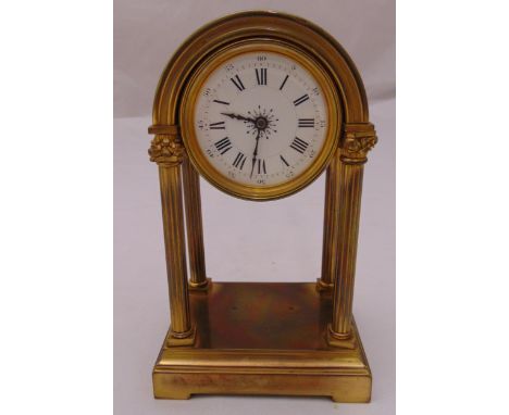 A late 19th century continental brass four column mantle clock, the white dial with Roman numerals, 18.5cm (h)