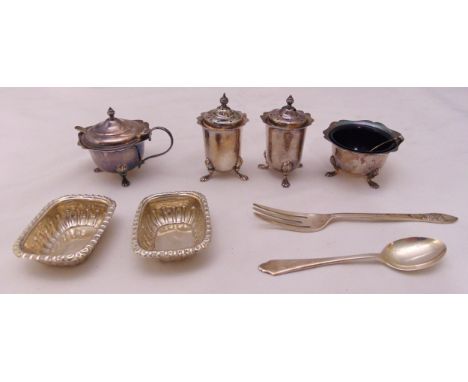 A quantity of hallmarked silver to include a four piece condiment set, two bonbon dishes, a spoon, a fork and two condiment s