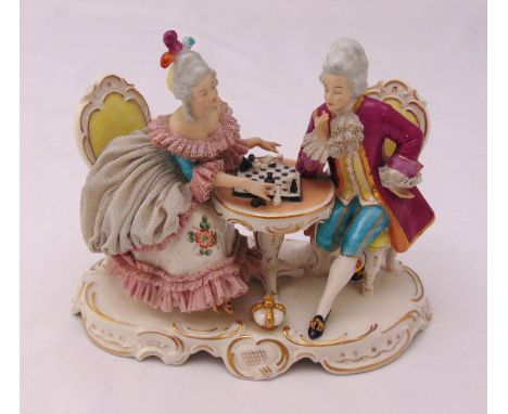Alka Kunst figural group of a lady and gentlemen in 18th century attire playing chess, marks to the base, 13cm (h)