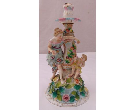 Sitzendorf figural candlestick with applied figures, flowers and leaves on raised circular base, A/F, 29.5 cm (h)