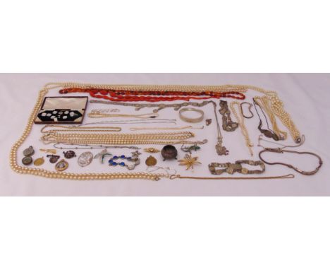 A quantity of silver and costume jewellery to include necklaces, brooches, bracelets and cased vintage mother of pearl button