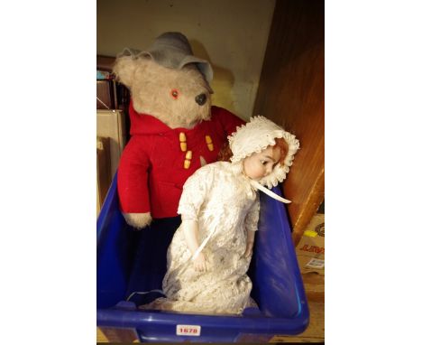 A reproduction bisque head doll, by 'Creations Past'; together with a Paddington bear. 