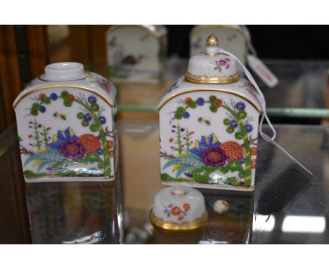 A small pair of Meissen tea canisters and covers, 9cm high, (finial of one restuck).&nbsp; 