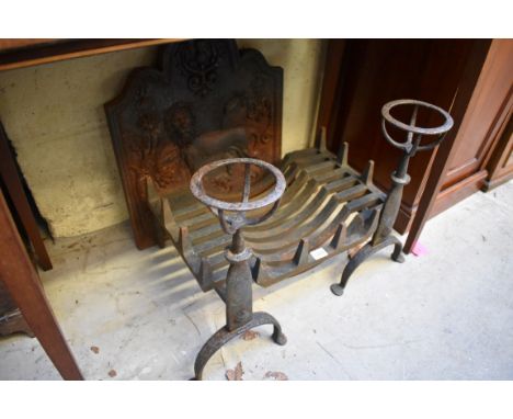 An antique cast iron fire back, relief decorated with a lion, 54 x 46cm; together with a pair of wrought iron fire dogs; and 