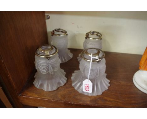 A set of four moulded clear frosted glass light shades.&nbsp;&nbsp; 