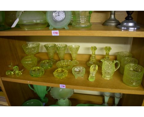 A collection of yellow uranium glass.&nbsp;(One shelf) 