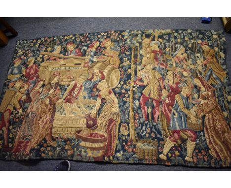 An old tapestry wall hanging,&nbsp;decorated with figures making wine, 194 x 116cm.&nbsp; 