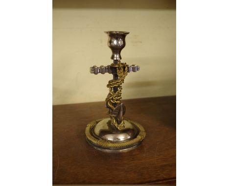 A brass and plated metal fouled anchor candlestick,&nbsp;18cm high.&nbsp; 