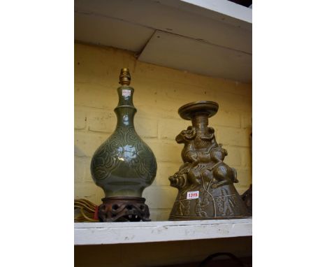 A celadon vase form table lamp,&nbsp;total height 40.4cm; together with another Eastern style pottery vase, 31.5cm high. 