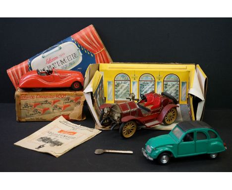 Three tin plate / metal models to include boxed clockwork Schuco Examico 4001 in red with key (very poor box), boxed Schuco 1