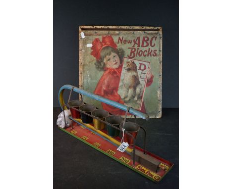 Early 20th century Louis Marx Tin Plate Skil Pail Toy, 53cms long, marbles replaced with ten ball bearings, condition general