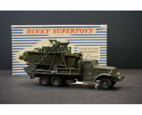 Boxed French Dinky Supertoys 884 Brockway Military Truck diecast model with bridge sections, paper play mat/instructions and 
