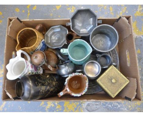An assortment of pewter tableware including "Tudric", a decorative brass tea caddy and four ceramic jugs.