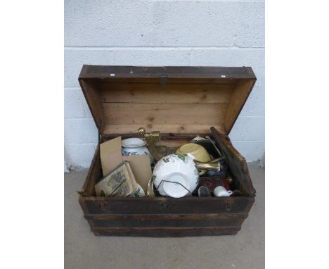 A dome topped trunk with an assortment of mixed collectables.