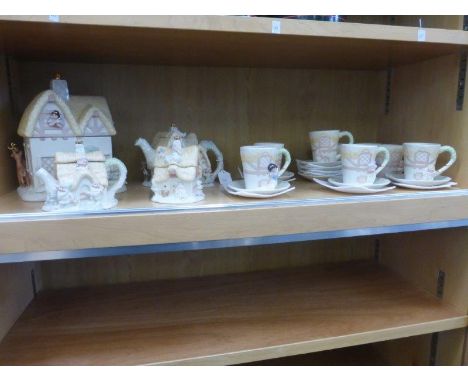 A Lenox Disney 2004 "The Seven Dwarfs Cottage" sugar and creamer set with a matching teapot, a Snow White and the Seven Dwarf