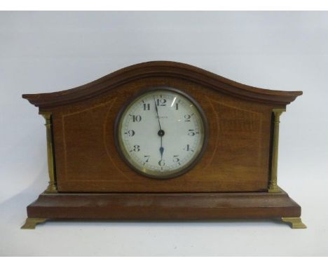 An Edwardian inlaid mahogany mantle clock.
