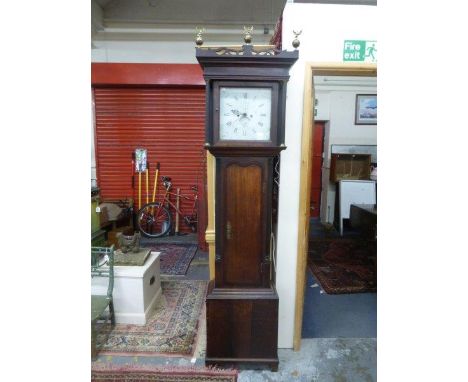 A 19th Century oak cased eight day longcase clock with a twelve inch painted dial.