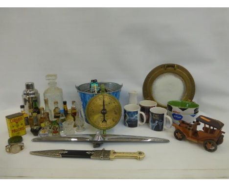 An assortment of collectables including advertising, miniature spirits, Salter scales etc..