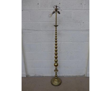 An unusual heavy brass standard light with bobbin turned column and a twin light fitting.