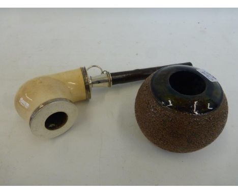 A Royal Doulton ceramic match striker and a meeshaum pipe.