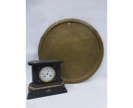 A slate mantle clock with enamel dial and roman numerals, also a circular brass tray.