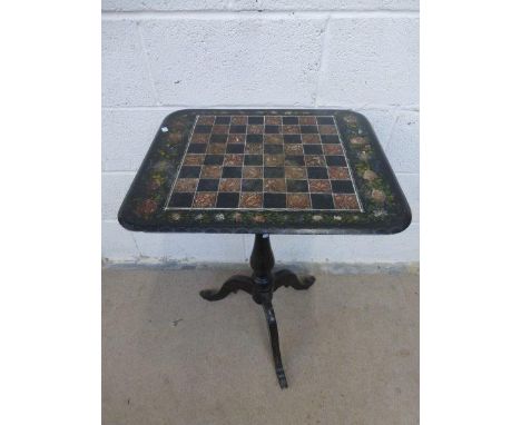 A 19th Century tripod games table with polychrome slate top.