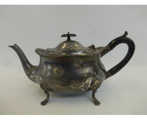 A silver teapot. Maker - William Hutton and Sons, London 1910.