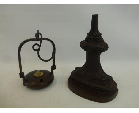 A Victorian cast iron No. 4 Coalbrookdale door stop and a French coal miner's iron  lamp.