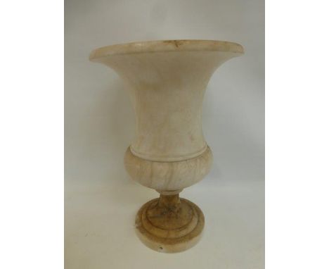 An alabaster pedestal urn converted to a lamp.