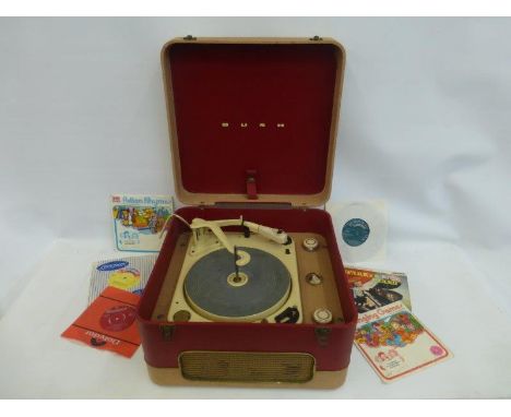 A Bush RC 1214H record player and an assortment of children's 45 singles.