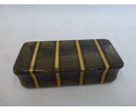 A horn inlaid snuff box.