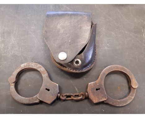 Pair early 20th Century American steel handcuffs by W. Darley &amp; Co, Chicago, with leather pouch (no key, light surface ru