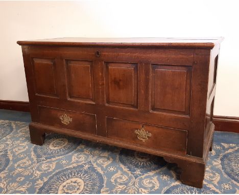 18th century panelled oak mule chest, fitted two drawers with four panel front on bracket feet, 133cm wide x 56cm deep x 82cm