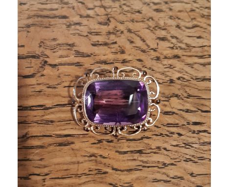 9ct gold mounted amethyst brooch of Victorian design, cushion cut stone 25mm x 10mm