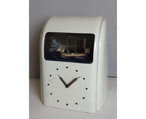 Vitascope Industries Ltd white bakelite Art Deco electric clock, with ship automaton, 31.5cm high, requires servicing by a qu
