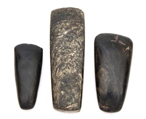 A group of three European Neolithic polished stone axe heads, circa 350 BC:.