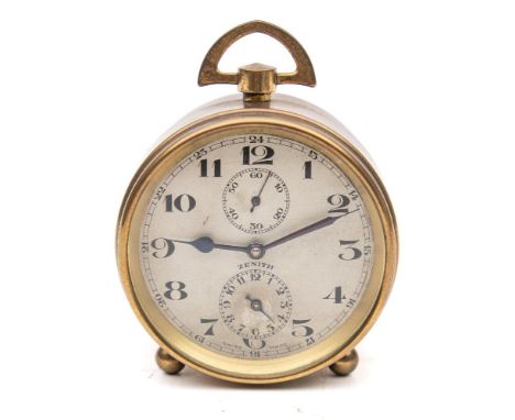 A small brass Zenith clock: having an eight-day duration timepiece movement, the round silvered dial having black Roman numer
